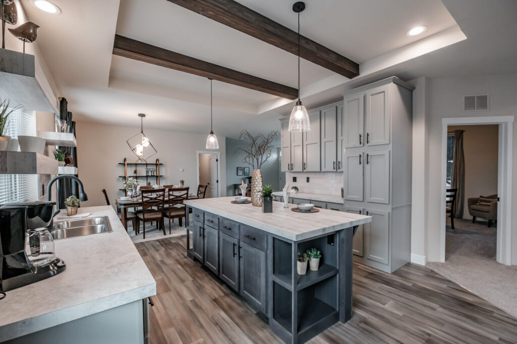spacious manufactured home kitchen with island and rustic finishes