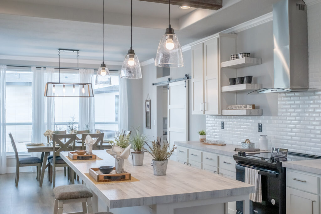 premium manufactured home kitchen with large kitchen island and modern, white finishes